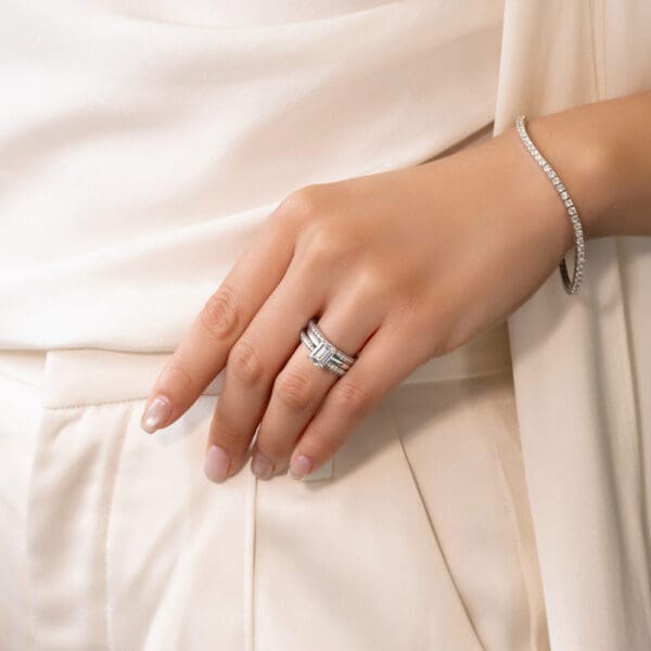 Model Wears Marie 1.3 1.5 White Gold Diamond Pinched Centre Pave Wedding Band Holly Emerald 2.00Ct Solitaire Ring