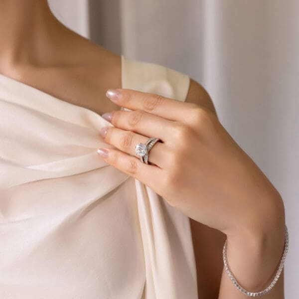Model Wears Marie 2.0 White Gold Moissanite Pinched Centre Pave Wedding Band Passion 9.0 Floral Open Gallery Pave Ring
