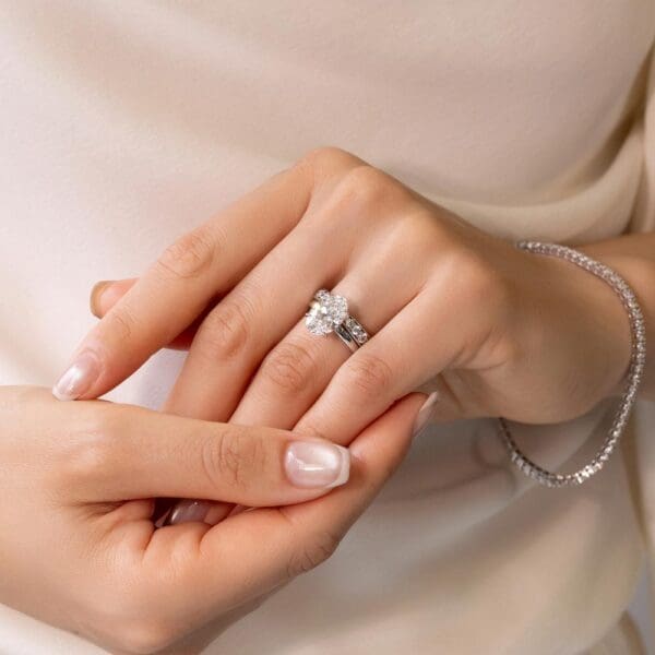 Model Wears Marie 2.5 White Gold Diamond Pinched Centre Pave Wedding Band Holly Oval 3.09Ct Solitaire Ring
