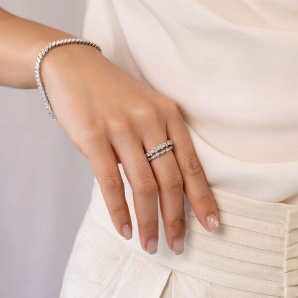 Model Wears Marlow White Gold Diamond Bezel Set Wave Shaped Pave Wedding Band Gigi Alternating Round Cluster Ring