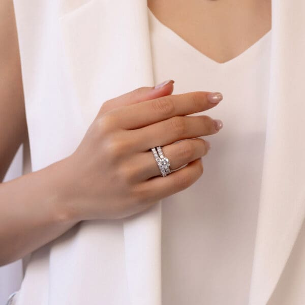 Model Wears Maxine 8.0 Moissanite Maxine A White Gold Diamond Round Open Scalloped Half Prong Set Wedding Band Ring