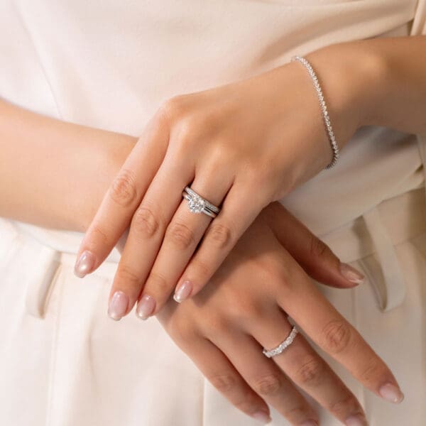 Model Wears Millie 1.3 White Gold Moissanite Pave Set Wedding Band Hazel 7.5 Round 6 Prong Solitaire Ring
