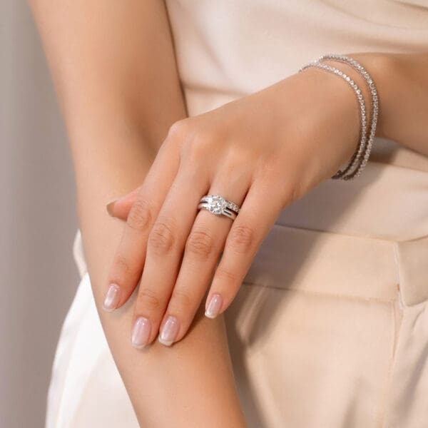 Model Wears Millie 1.7 White Gold Moissanite Pave Set Wedding Band Fiona Round 9.0 Four Prong Solitaire Ring