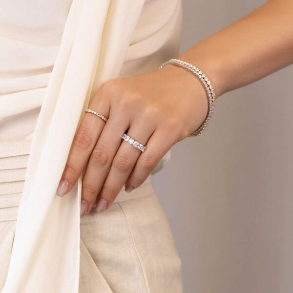 Model Wears Piper White Gold Diamond Prong Set Cushion Wedding Band Bella Alternating Baguette Double Round Wedding Ring