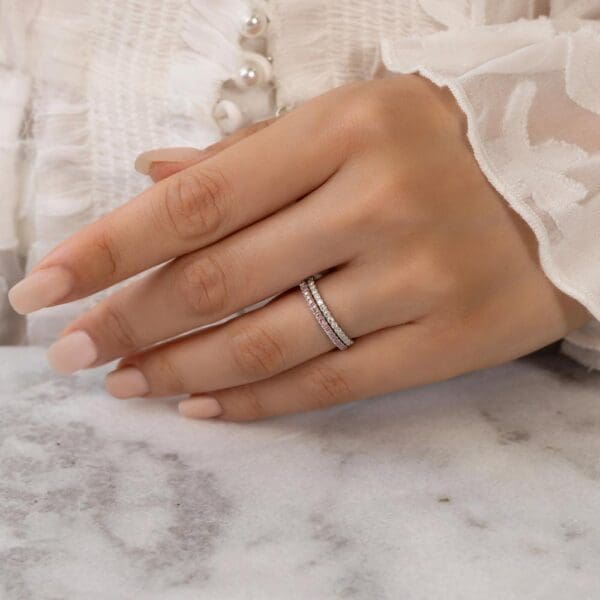 Model Wears Rosewood A White Gold Moissanite Straight Prong Set Wedding Band Angela 1.5 Diamond U Prong Half Set Wedding Ring