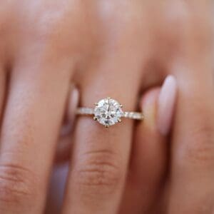 Model Wears Rosewood Round 7.5 Yellow Gold Diamond 6 Prong Open Basket U Prong Half Band Ring