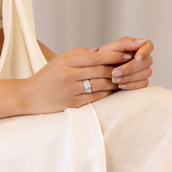 Model Wears Sia A White Gold Diamond Princess Cut Channel Set Wedding Ring Sia 6.5 Square Baguette Low Setting Ring