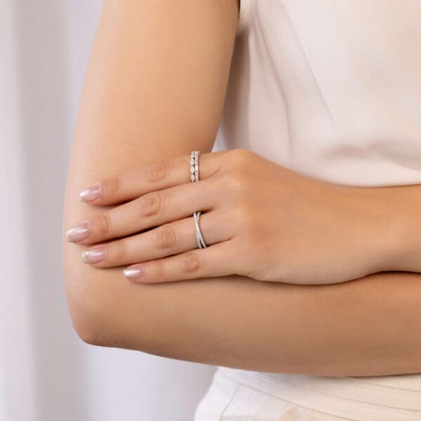 Model Wears Tessa White Gold Diamond Crossover Eden Marquise Shared Prong Britanny Alternating Baguette Round Wedding Ring