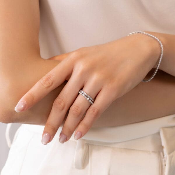 Model Wears White Gold Diamond Carmen 1.1 Channel Set Wedding Band Evie Alternating Marquise Round Shared Prong Ring