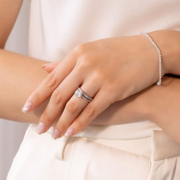 Model Wears White Gold Diamond Carmen 1.5 Channel Set Wedding Band Hattie Round 2.00Ct Under Rail Bridge Stone Set Ring