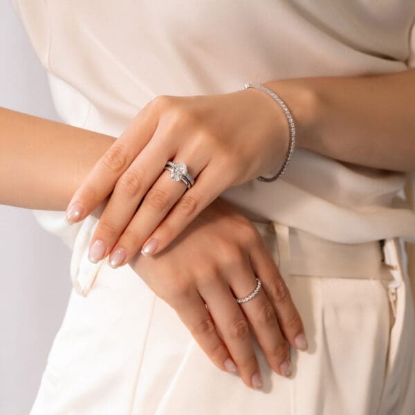 Model Wears White Gold Diamond Marie 1.7 Pinched Centre Pave Wedding Band Holly Oval 3.09Ct Solitaire Ring