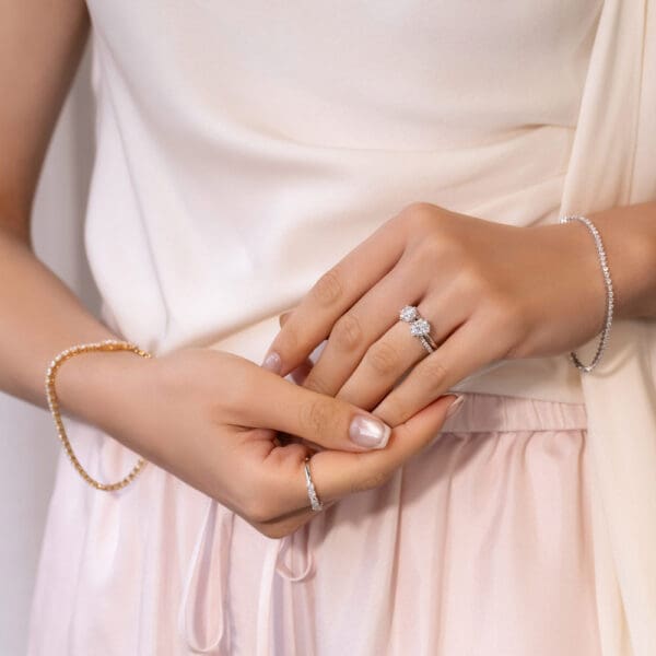 Model Wears White Gold Moissanite Annerley 6.5 Solitaire Knife Edge Claire 8X6 Oval Interlocking Prong Set Toi Et Moi Ring