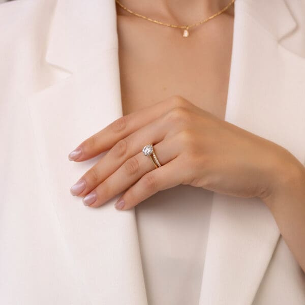 Model Wears Yellow Gold Diamond Ava A Prong Set Wedding Band Lanefield Round 8.0 Cathedral Open Gallery Solitaire Ring