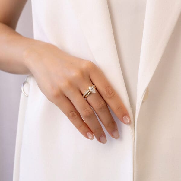 Model Wears Yellow Gold Diamond Carmen 2.0 Channel Set Wedding Band Holly Marquise 1.51Ct Solitaire Ring