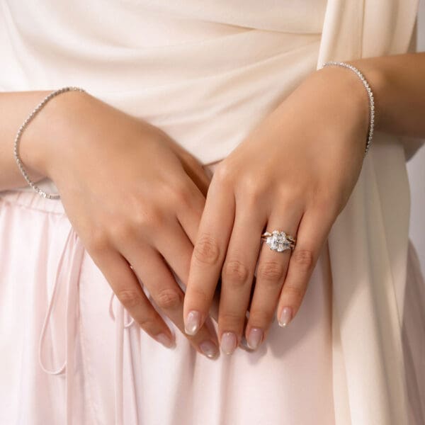 Model–Wears White Yellow Gold Moissanite Emma Marquise Round Wedding Band Aubrey Radiant 9X7 Double Prong Trilogy Ring