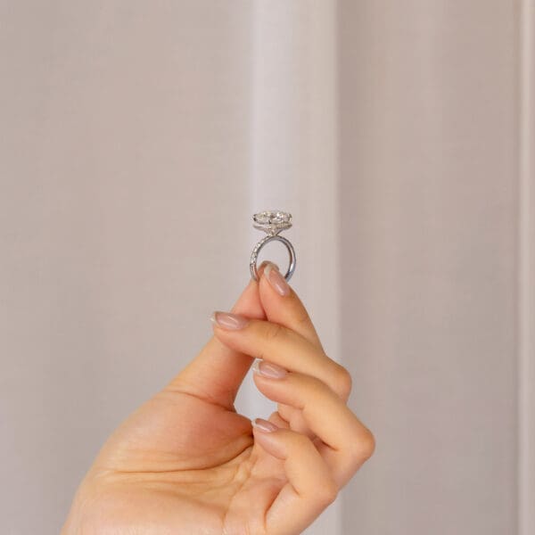 Hand Held Katrina White Gold Moissanite Cushion Hidden Knife Edge Halo Ring