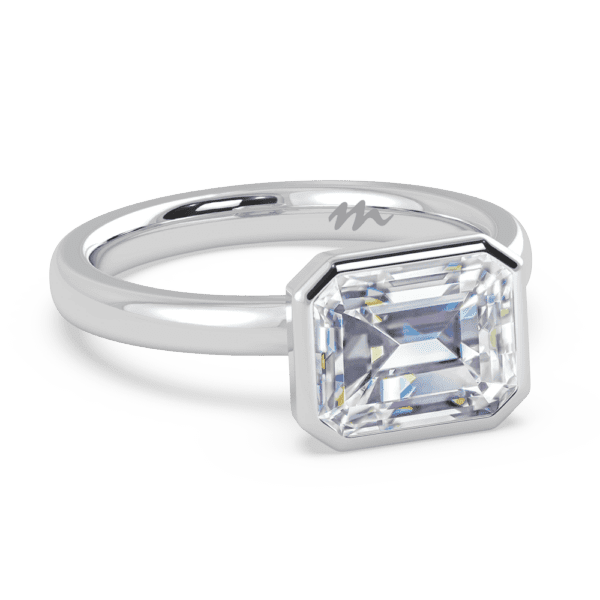 Iliana 9X7 Angled White Gold Moissanite East West Emerald Semi Rounded Solitaire Ring