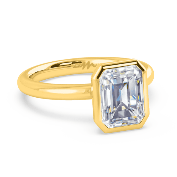 Lottie Emerald 9X7 Angled Yellow Gold Diamond Bezel Rounded Solitaire Ring