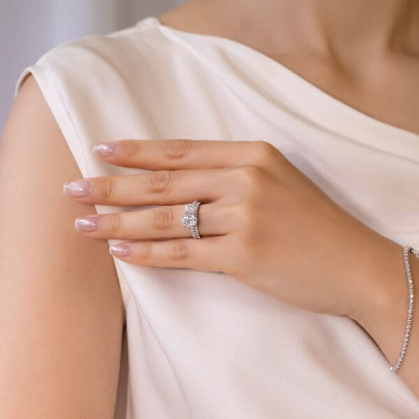 Model Wears Angela 1 5 Platinum U Prong Set Wedding Band Blanche 8X6 White Gold Moissanite Round Oval Toi Et Moi Ring