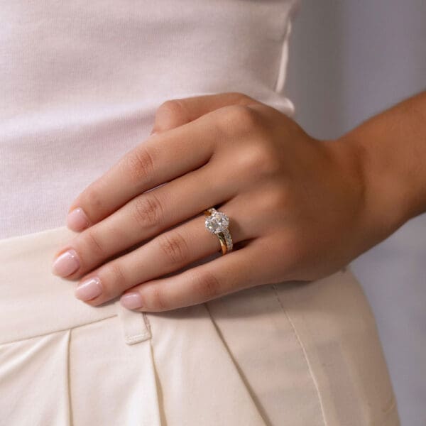 Model Wears Angelica 2 5 U Prong Set Yellow Gold Wedding Band Holly Oval 2 50Ct Diamond Engagement Ring