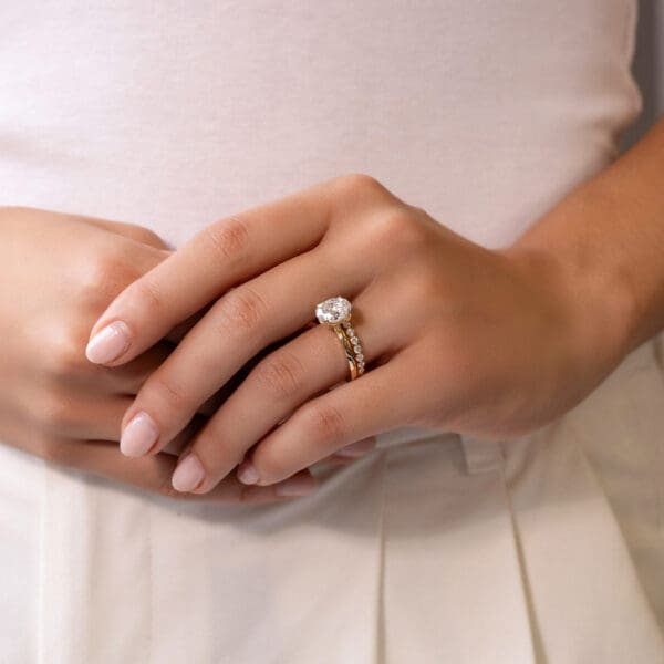 Model Wears Gracie 2 0 Lab Grown Diamond Scalloped Shared Prong Holly Oval 10X8 Yellow Gold Solitaire Rings