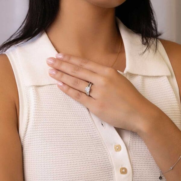 Model Wears Holly Cushion 7 0 White Gold Diamond Four Prong Solitaire Ring Angelica 2 0 U Prong Set Wedding Band