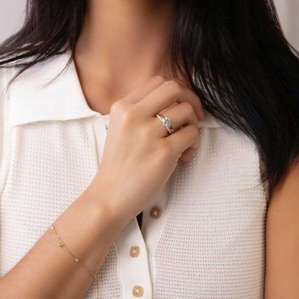 Model Wears Holly Round 1 52Ct Yellow Gold Diamond 4 Prong Solitaire Ring Angela 1 7 Moissanite U Prong Half Set Wedding Band