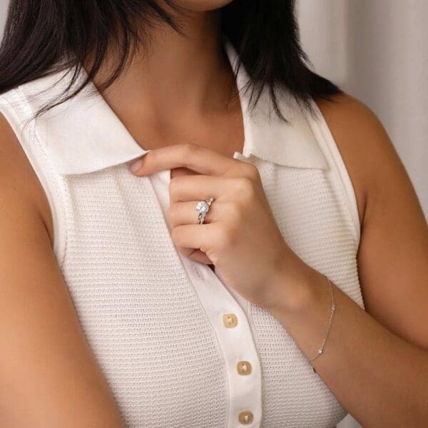 Model Wears Holly Round 8 5 White Gold Diamond 4 Prong Solitaire Ring Eden Moissanite Marquise Shared Prong Wedding Band