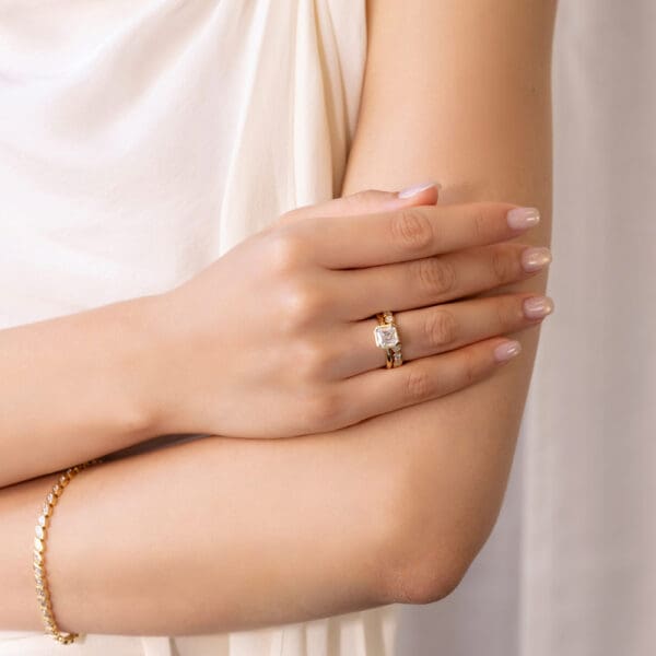 Model Wears Lottie Asscher 7 0 Yellow Gold Moissanite Solitaire Ring Roxie 2 5 Round Bezel Set Band