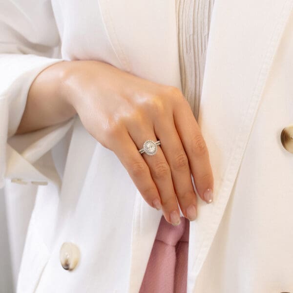 Model Wears Louisa Oval 7X5 White Gold Diamond Double Halo Ring Angela 1 1 U Prong Half Set Wedding Band