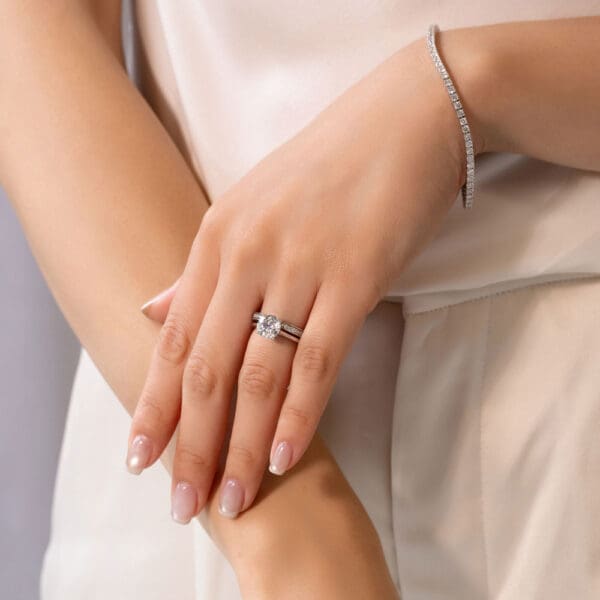 Model Wears Marie 1 5 White Gold Diamond Pinched Centre Pave Wedding Band Hattie Round 2 00Ct Stone Set Under Rail Ring