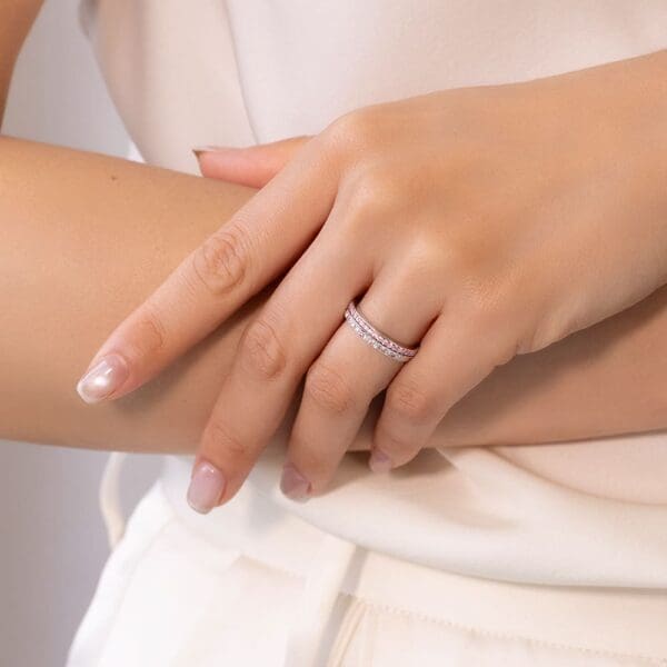 Model Wears Millie 1 3 White Gold Pink Diamond Pave Set Angelica 1 5 Alternating Pink U Prong Wedding Rings