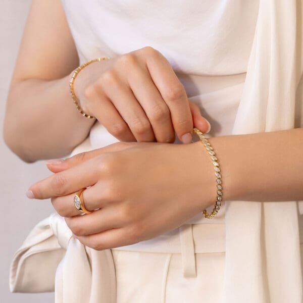 Model Wears Priya Yellow Gold Lab Grown Diamond Marquise Bezel Tennis Bracelet