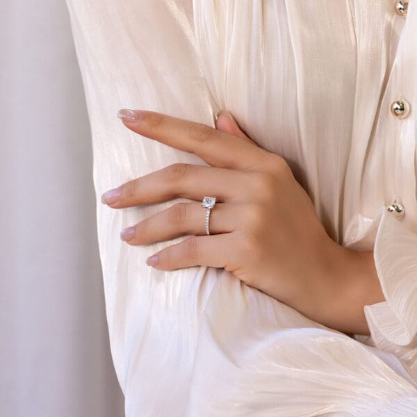 Model Wears Rosewood Cushion 7 5 White Gold Moissanite 4 Prong Open Basket Engagement Ring