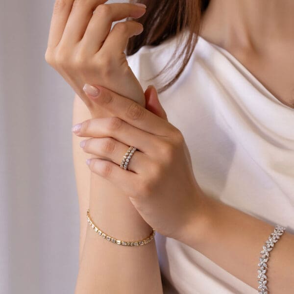 Model Wears Roxie 2 0 White Yellow Gold Moissanite Round Bezel Set Band Wedding Ring