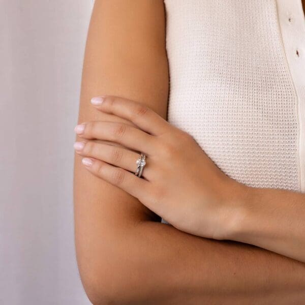 Model Wears White Gold Diamond Holly Oval 8X6 Half Rounded Band Solitaire Ring Millie 1 3 Moissanite Pave Set Wedding Band