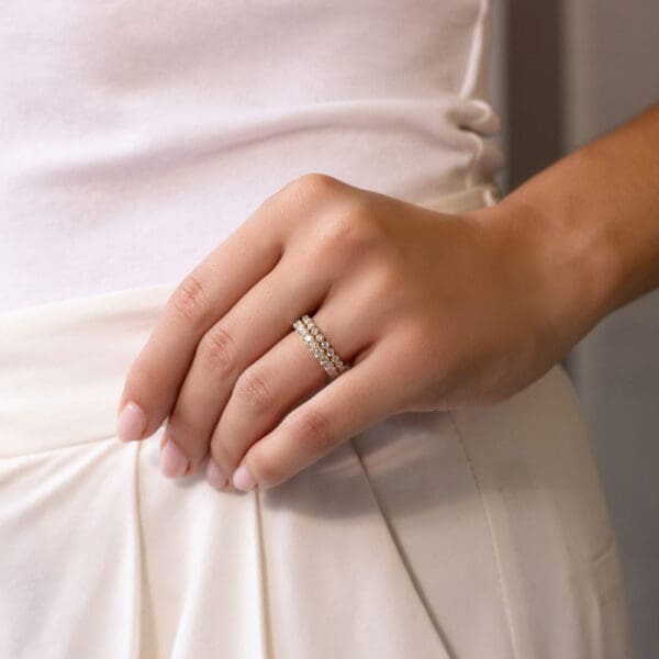 Model Wears Yellow Gold Diamond Gracie 2 0 Shared Prong Scalloped Round Band Angelica 2 5 U Prong Set Wedding Ring