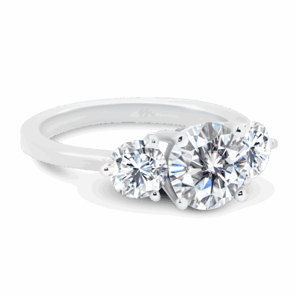 Kiara Angled White Gold Moissanite Round 4 Prong Centre 3 Prong Side Stones Trilogy Ring