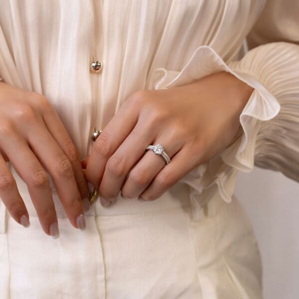 Model Wears Amelia 7 5 White Gold Diamond Floral Basket Graduating Band Edith 1 3 Straight Band V Dip Centre Wedding Ring