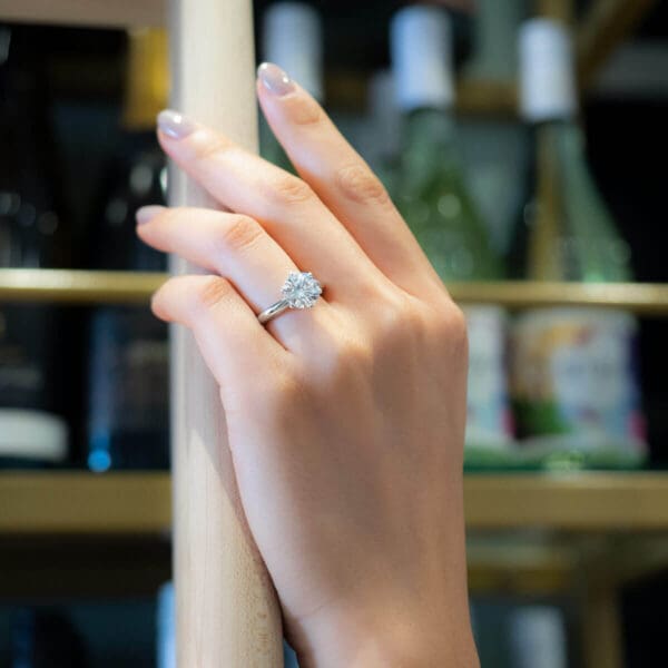 Model Wears Audrey 9 0 White Gold Diamond 6 Prong Knife Edge Solitaire Ring