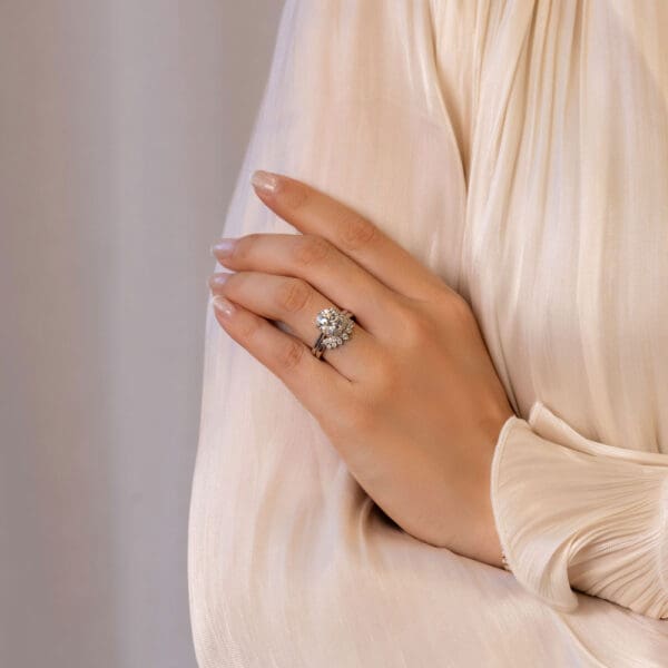 Model Wears Coral 3 07Ct White Gold Diamond Protea Basket Accented Bridge Solitaire Soraya Graduated Round Tiara Jigsaw Ring