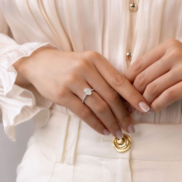 Model Wears Harmony Pear 10X7 White Gold Diamond 4 Prong Encrusted Under Rail Bridge Engagement Ring