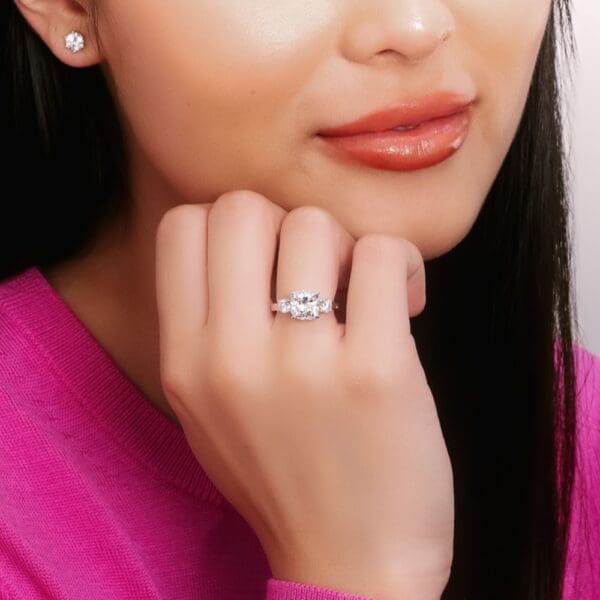 Model Wears Marigold Diamond Cushion 4 Prong Crossover White Gold Trilogy Ring