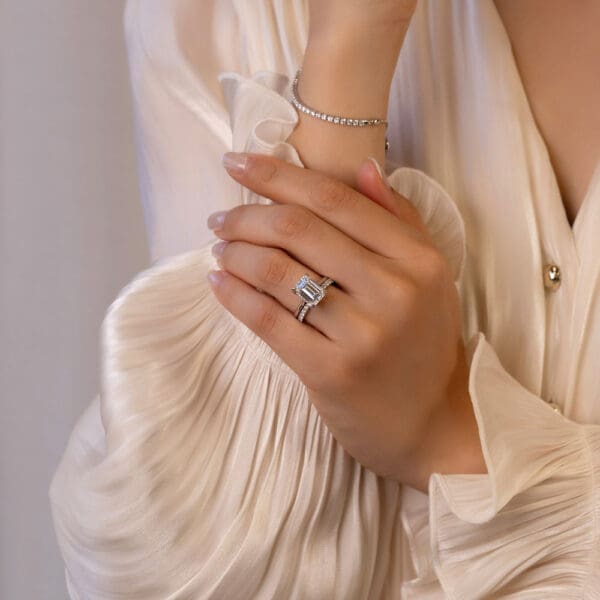 Model Wears Primrose Emerald 4 02Ct White Gold Diamond Petal Basket Underrail Accented Bridge Angelica 1 7 U Prong Set Ring