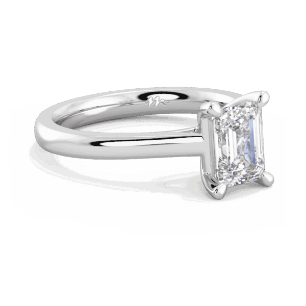 Lydia Emerald 7X5 Angled White Gold Moissanite 4 Prong V Setting Tapered Band Solitaire Ring