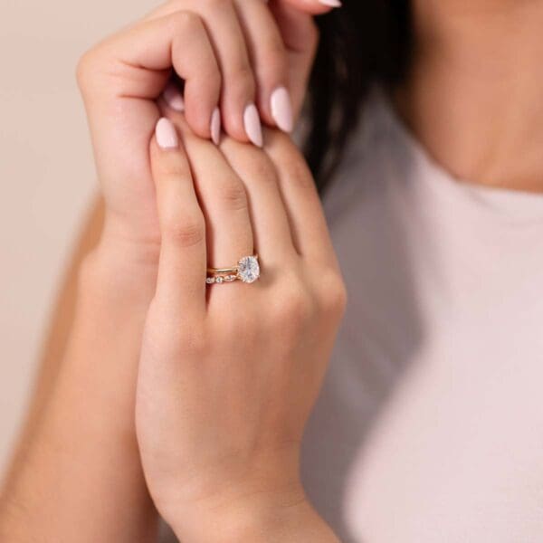 Model Wears Hattie Oval 9X7 Diamond Accents Under Rail Bridge Tapered Ring With Evie Yellow Gold Alternating Band