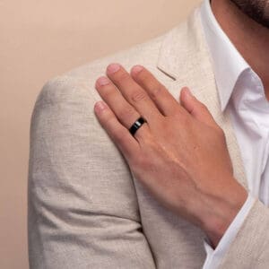 Model wears ZRPJ498 7mm hypoallergenic black zirconium flat band with rounded beveled edges wedding rings for men