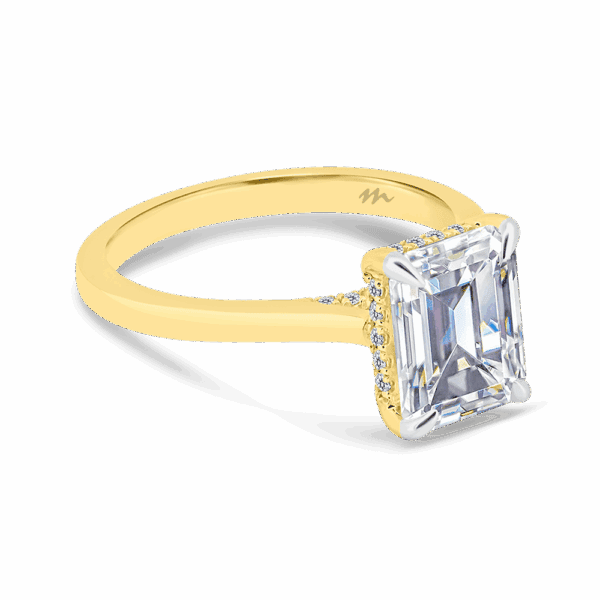 Hattie Emerald 9X7 Angled Yellow Gold Moissanite 4 Prong Accented Under Rail Bridge Tapered Engagement Ring