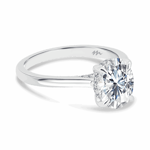 Hattie Oval 9X7 Angled White Gold Moissanite 4 Prong Accented Under Rail Bridge Tapered Engagement Ring