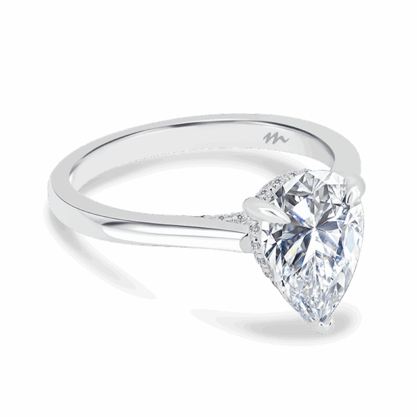 Hattie Pear 10X7 Angled White Gold Moissanite 4 Prong Accented Under Rail Bridge Tapered Engagement Ring